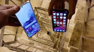 Dropping Samsung Galaxy S20 vs iPhone 11 Pro Down Spiral Staircase - 200 Feet - Will It Survive?